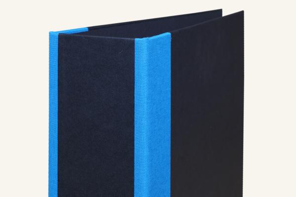 black folder with blue linen corners